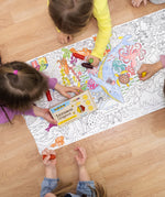 Children colouring in a large ocean scene on the floor, using the Medenka junior beeswax crayons.