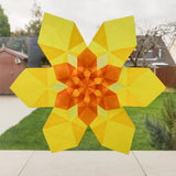 Window display showing a yellow daffodil made from Kite waxed paper