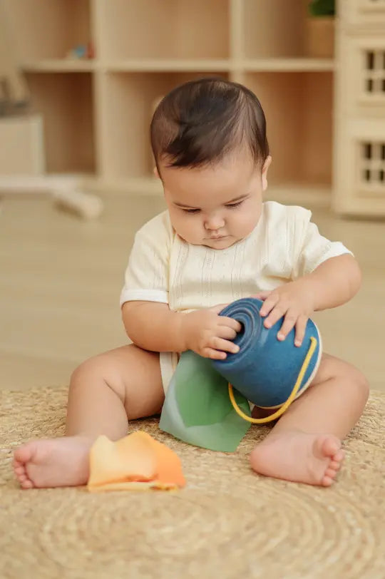 PlanToys reusable baby tissue box toy, made from PlanWood with chiffon tissues, to represent PlanToys Montessori toys at Babipur.
