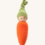 Nanchen Carrot Rattle Doll. A beautifully handcrafted rattle in the shape of an orange carrot, with a green hat. On a cream background