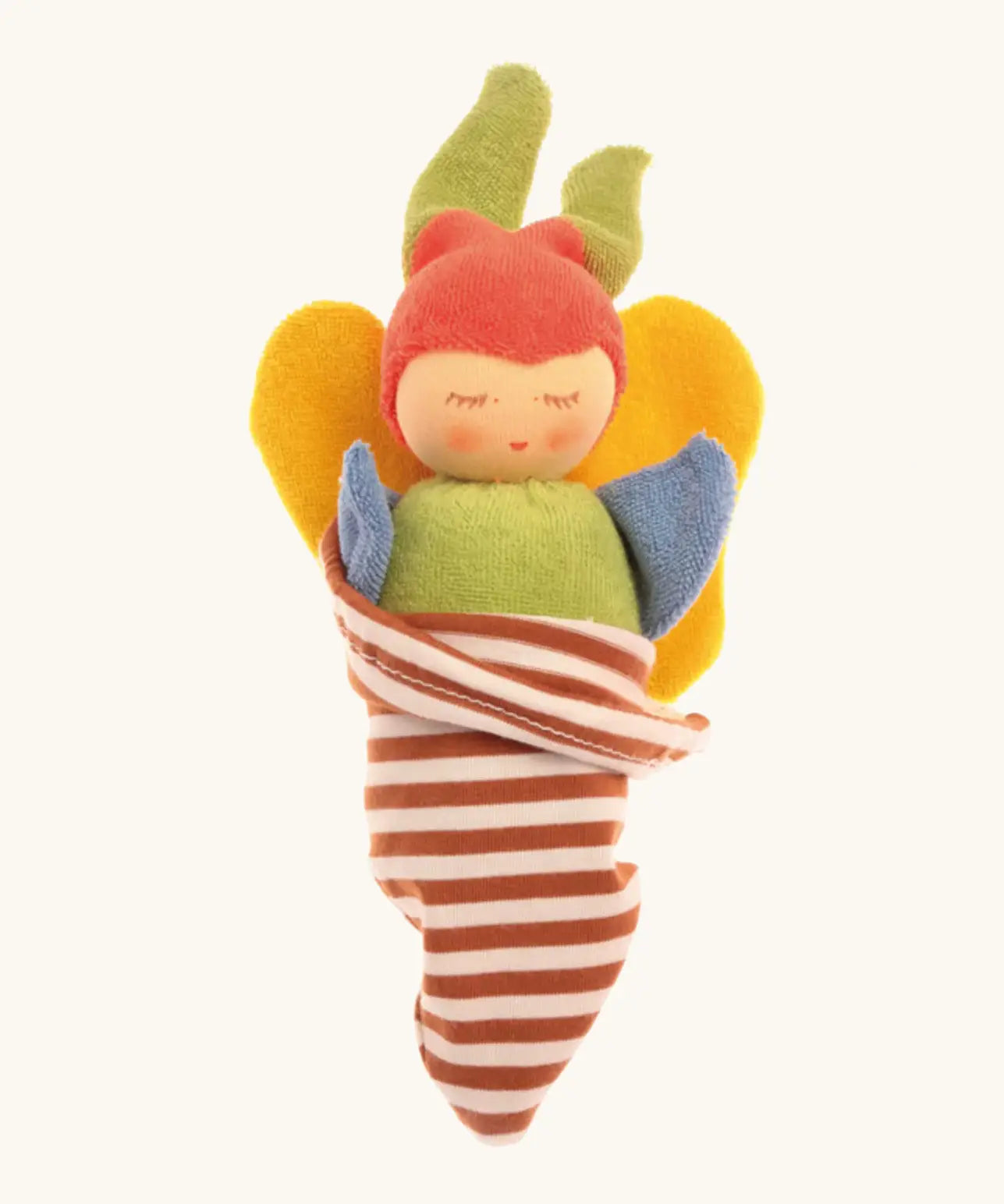 Nanchen soft butterfly doll in a brown striped blanket. Features a green body, blue arms, yellow wings and a red hat.