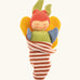 Nanchen soft butterfly doll in a brown striped blanket. Features a green body, blue arms, yellow wings and a red hat.