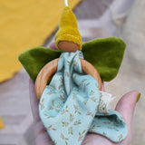 Nanchen flower fairy grasping toy made from organic cotton, each with a wooden ring, green velour wings, a yellow pointed hat, and a hanging loop, available at Babipur.