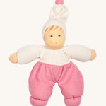 Nanchen Möpschen Doll - Pink. A soft and cuddly doll with pink trousers, a white top and white hat with a pink bobble on top