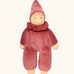 Nanchen nani soft doll in cedar pink with a waldorf style face. Showing a red with white spots frilled scarf and red hat
