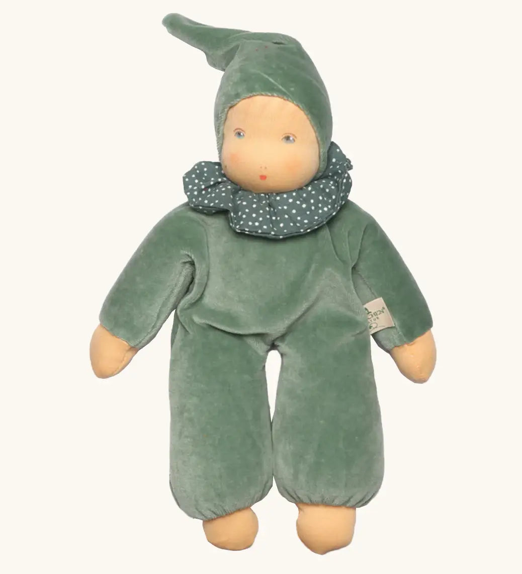 Nanchen nani soft doll in mint green with a waldorf style face. Showing a green with white frilled scarf and hat