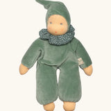 Nanchen nani soft doll in mint green with a waldorf style face. Showing a green with white frilled scarf and hat