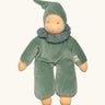 Nanchen nani soft doll in mint green with a waldorf style face. Showing a green with white frilled scarf and hat