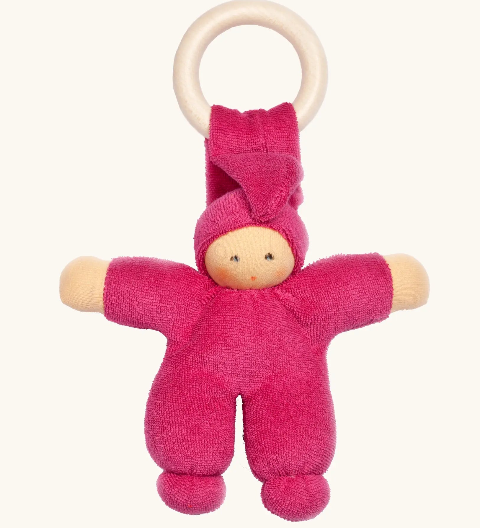 Nanchen Pimpel Doll Baby Comforter in berry pink with a Waldorf-style face and wooden teething ring attached by its hat. 