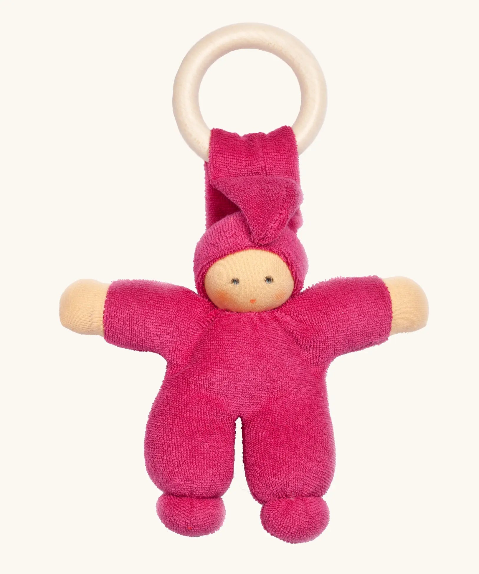 Nanchen Pimpel Doll Baby Comforter in berry pink with a Waldorf-style face and wooden teething ring attached by its hat. 