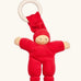 Nanchen Pimpel Doll Baby Comforter in cherry red with a Waldorf-style face and wooden teething ring attached by its hat. 