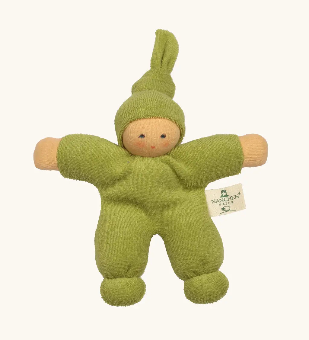 Nanchel pimpel waldorf doll in green. Showing cute facial features and a tie on the hat. Doll has a terry cloth body 