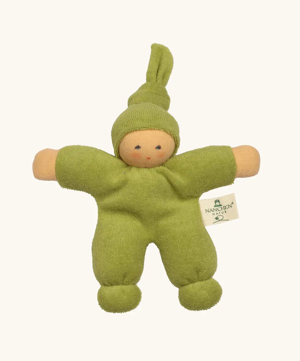 Nanchel pimpel waldorf doll in green. Showing cute facial features and a tie on the hat. Doll has a terry cloth body 