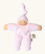 Nanchel pimpel waldorf doll in pastel pink. Showing cute facial features and a tie on the hat. Doll has a terry cloth body 