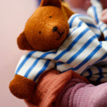 A beautifully handmade teddy bear comforter toy, the Nanchen Baby Comforter - Bear has brown face and  hands, and a blue and white stripe body