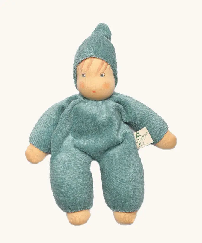 Nanchen soft cuddle doll in mint green with a waldorf style face. Doll has a matching hat a finished in terry cloth.