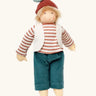 Nanchen chestnut child Paul doll with a waldorf style face. Showing removable white waistcoat, stripy top and blue trousers and chestnut hat