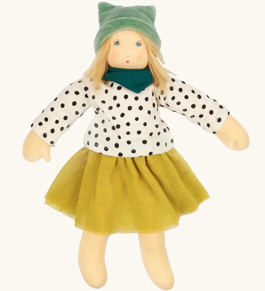 Nanchen Mascha waldorf doll showing a green terry cloth, long sleeve top with black dots, a yellow skirt and a green scarf