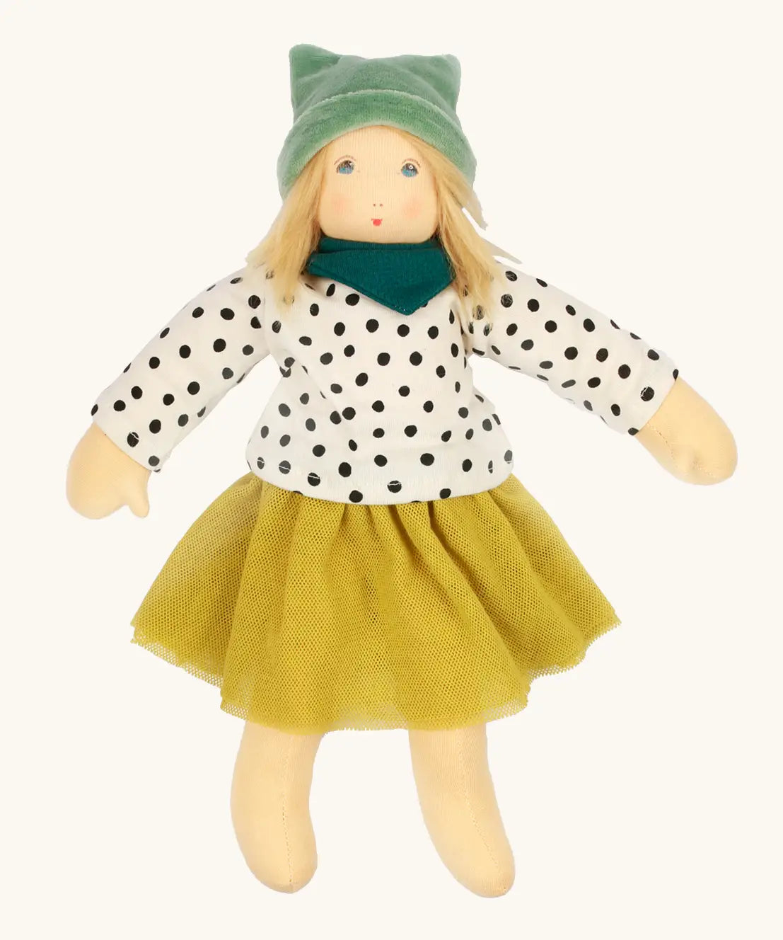 Nanchen Mascha waldorf doll showing a green terry cloth, long sleeve top with black dots, a yellow skirt and a green scarf