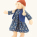 Nanchen Lotta winterchild doll with a Waldorf style face, blonde hair. Showing removable blue waistcoat, navy floral dress and orange hat