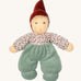 Nanchen Forest Child Waldorf Doll - Sage. This beautifully handcrafted doll wears sage velour trousers, a brown hat and a floral top. On a cream background