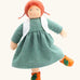 Nanchen Charlotte orange friends doll with a Waldorf style face, red hair. Showing removable white waistcoat, green dress and orange shoes
