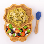 Eco Rascals Dinosaur Bamboo Suction Plate with spaghetti and mushrooms with a Greek salad side, and blue silicone and bamboo baby spoon.