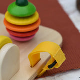 Close up of the velcro straps in the sides on the Nic baby game busy board toy.
