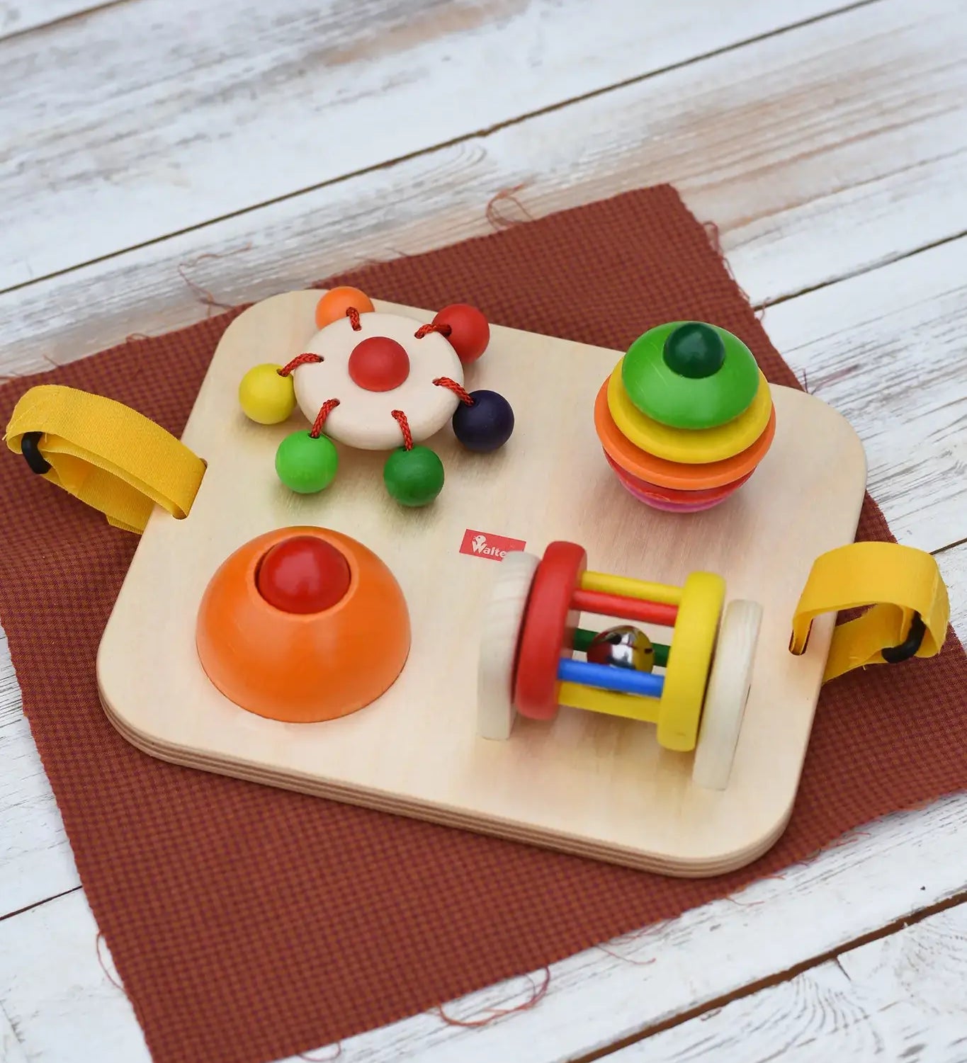 Nic Wooden Baby Game busy Board with 4 four activities. Spin the carousel, squeaky button, rattling tree top and roller.