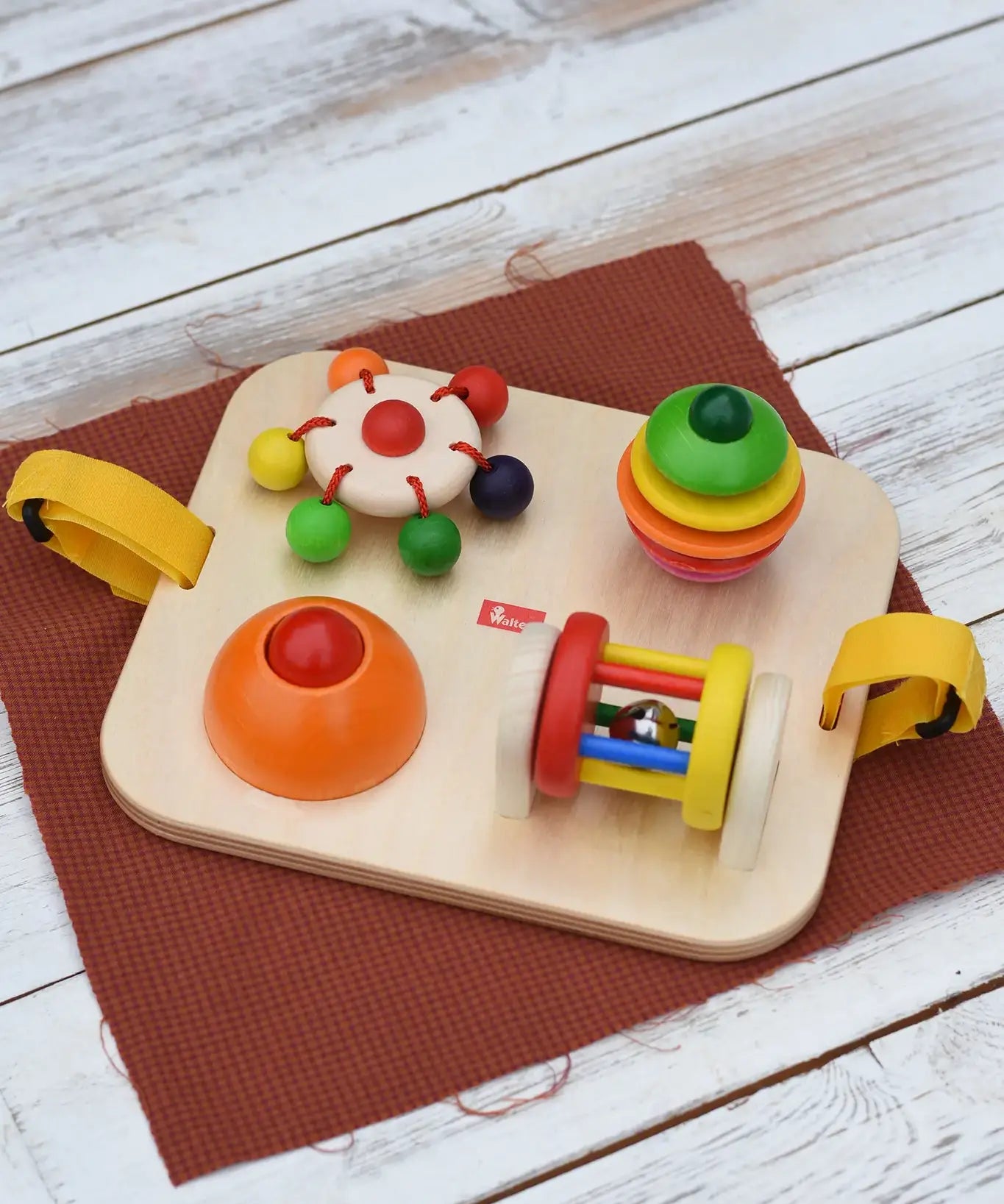 Nic Wooden Baby Game busy Board with 4 four activities. Spin the carousel, squeaky button, rattling tree top and roller.