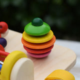 Close up of the rattling tree top  attached to the Nic Wooden Baby Game busy Board with 4 four activities.