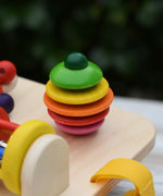 Close up of the rattling tree top  attached to the Nic Wooden Baby Game busy Board with 4 four activities.