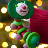 Baby wooden grasping toy, Nic Apple Worm, a smiling worm on a flexible rope lined with chunky red and green beads, for sale at Babipur. 