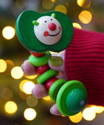 Baby wooden grasping toy, Nic Apple Worm, a smiling worm on a flexible rope lined with chunky red and green beads, for sale at Babipur. 