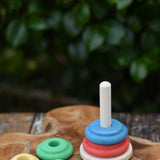 Nic Classic Stacking Tower placed on a wooden board with the top three pieces taken off.