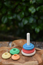 Nic Classic Stacking Tower placed on a wooden board with the top three pieces taken off.