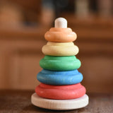 Nic Classic Stacking Tower wooden baby toy placed on a table.