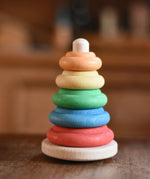 Nic Classic Stacking Tower wooden baby toy placed on a table.