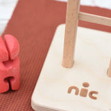 Close up of the Nic logo on the ladder of the Nic climbing wooden ladder toy.