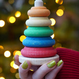 Baby wooden ring stacking toy by Nic Toys, Plug Column, natural wooden bade with chunky colourful rings, available to buy at Babipur.

