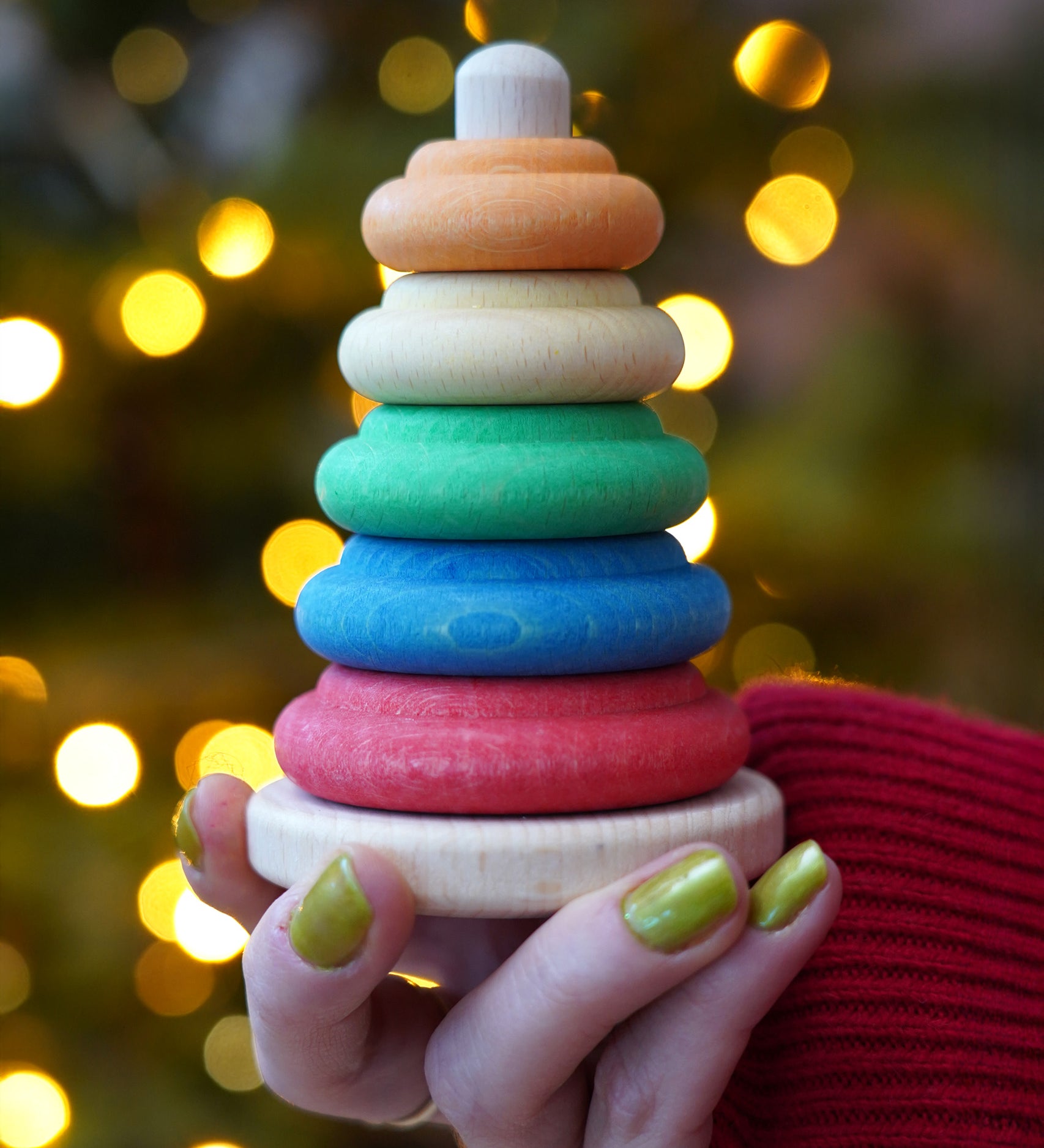 Baby wooden ring stacking toy by Nic Toys, Plug Column, natural wooden bade with chunky colourful rings, available to buy at Babipur.
