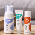 A collection of the OY skin care range, including foaming face wash, purifying serum and cleansing moisturiser 