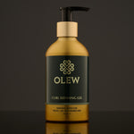 Olew Curl Defining Natural Hold Gel, vegan haircare which is SLS and Paraben Free in a gold and dark green bottle with a push down pump top, on a dark grey background