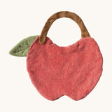 The reverse side of the Oli & Carol Peppa the apple baby bib available at Babipur. A organic cotton bib in a shape of a red apple cut in half. Features a popper fastener for size adjustment. 
