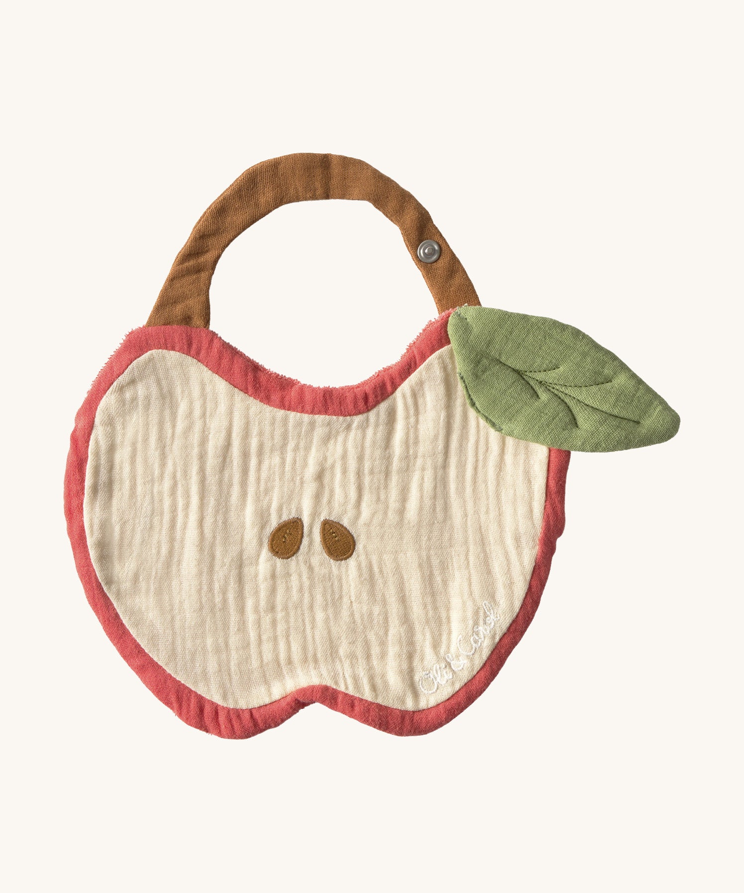 Oli & Carol Peppa the apple baby bib available at Babipur. A organic cotton bib in a shape of a red apple cut in half. Features a popper fastener. 