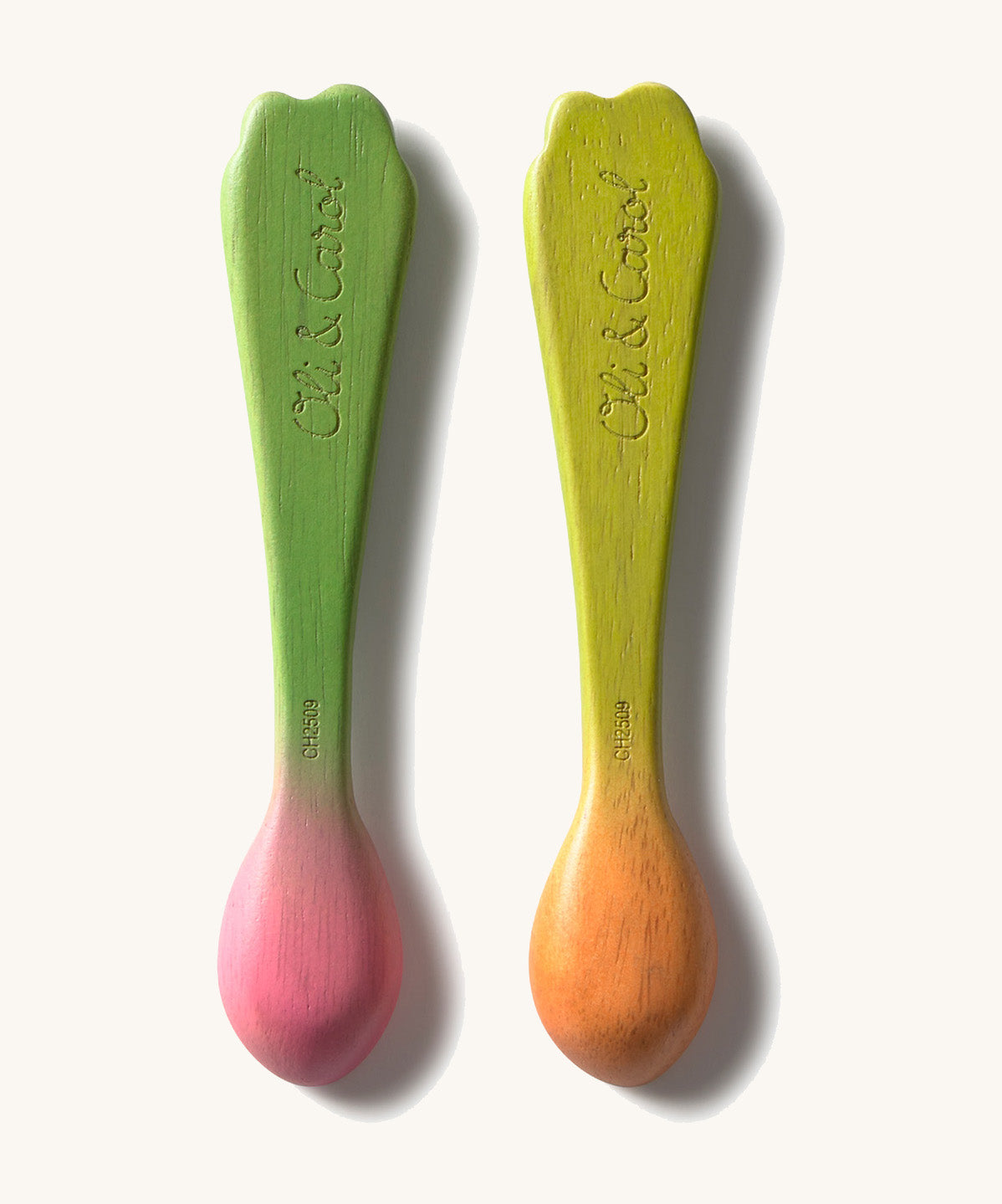 The back of the Oli & Carol 2 pack baby wooden spoons in a radish and carrot design and available at Babipur. Features the brand name on the handle