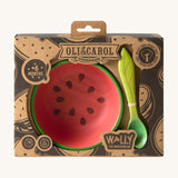 A close up of the cardboard packing holding the Oli & Carol Wally the watermelon wooden bowl and spoon set available at Babipur. 