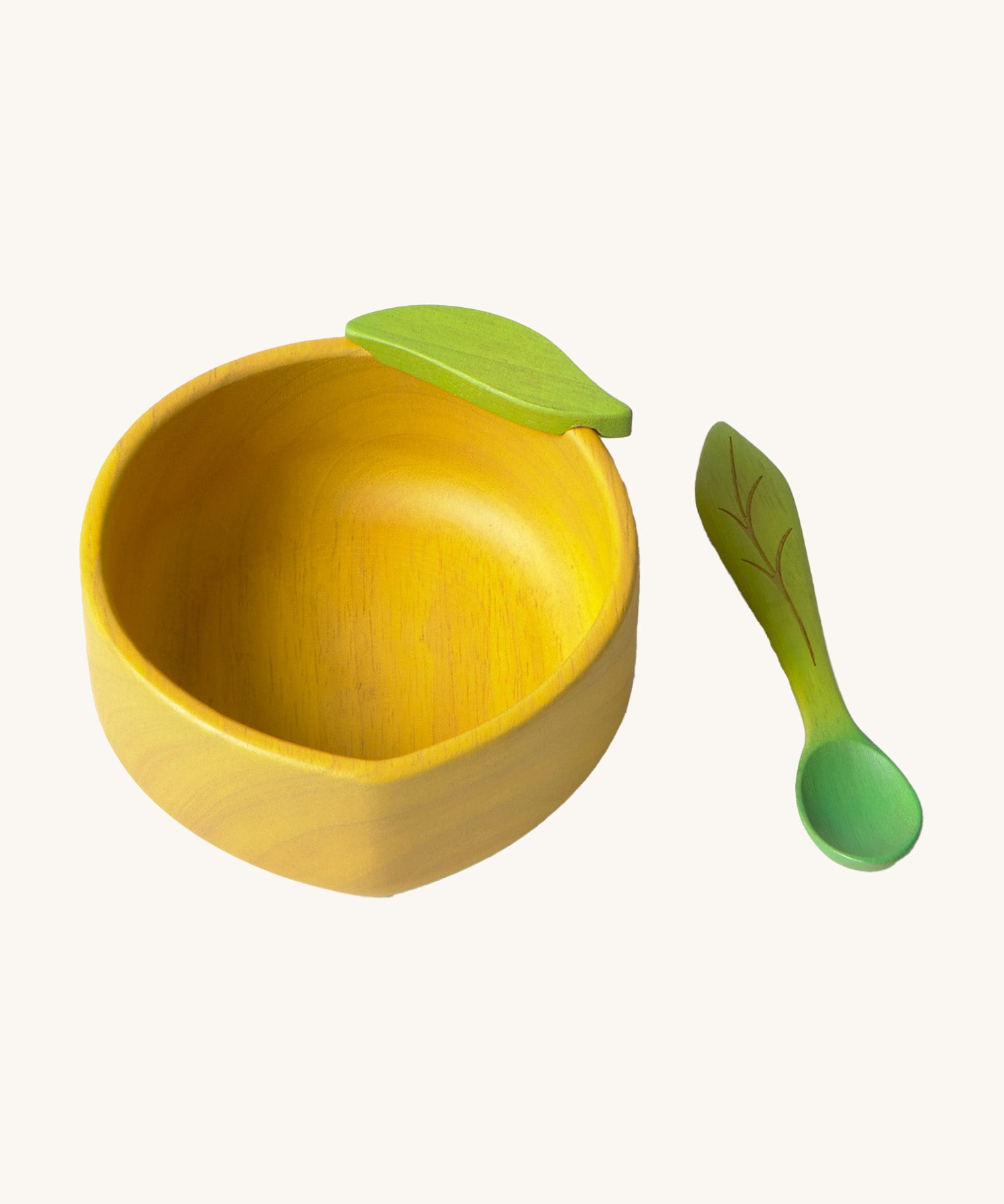 Oli & Carol Lou the lemon wooden bowl and spoon set available at Babipur. 