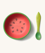 Oli & Carol Wally the watermelon wooden bowl and spoon set available at Babipur.  The bowl is in a shape of a watermelon cut in half