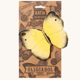 The Oli & Carol Natural Rubber Teether - Katia The Butterfly on its cardboard packing slip on a cream background